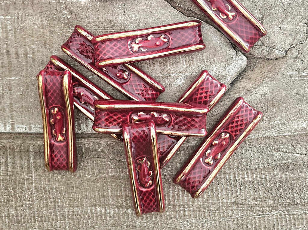 Lot de 10 porte-couteaux vintage en céramique rouge rubis et doré
